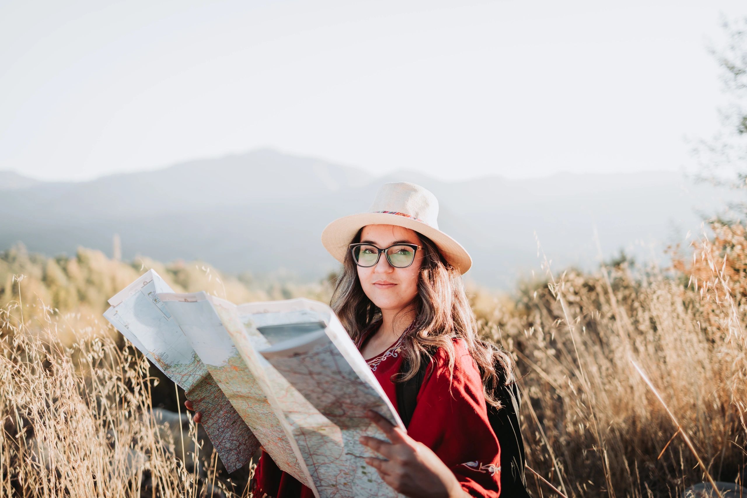 Camper checking a map while hiking outdoors