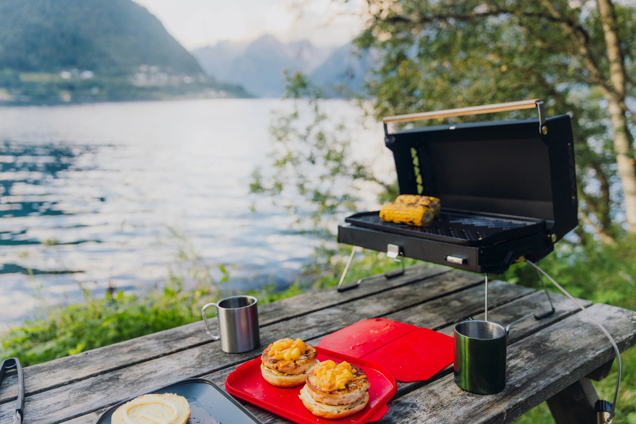 Outdoor camp cooking setup at sunset