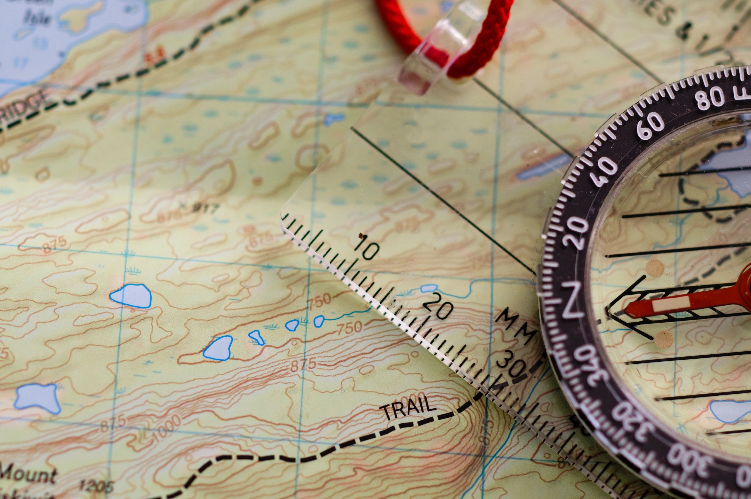Compass placed on an outdoor map